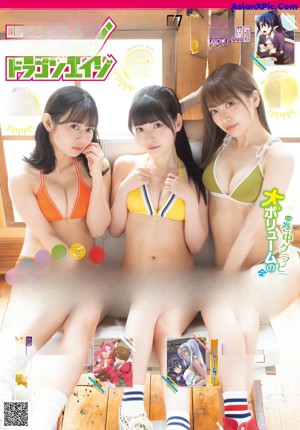A woman in an orange bikini eating a hamburger.