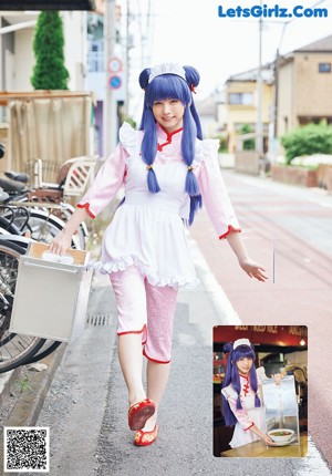 A woman in a school uniform posing for a picture.