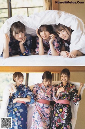 A group of three young women laying on top of a bed.