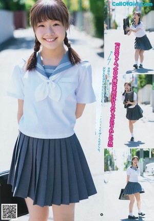 A young woman standing in front of a window holding a book.