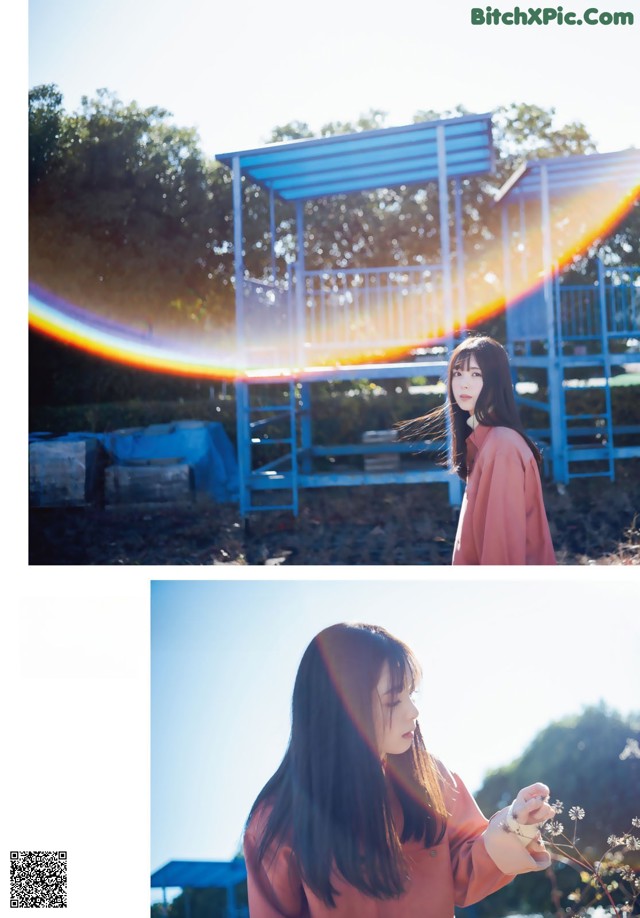 A woman holding a flower in front of a rainbow.