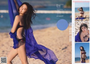 A woman in a white bikini on the cover of a magazine.