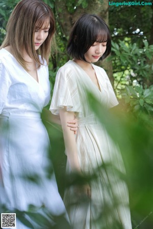 A couple of women that are standing next to each other.
